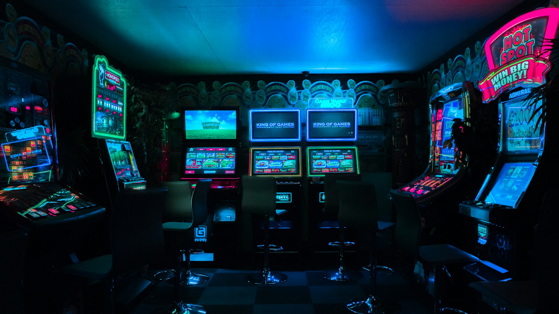 Players competing on glowing gaming rigs inside the EpicReelEmpire arena